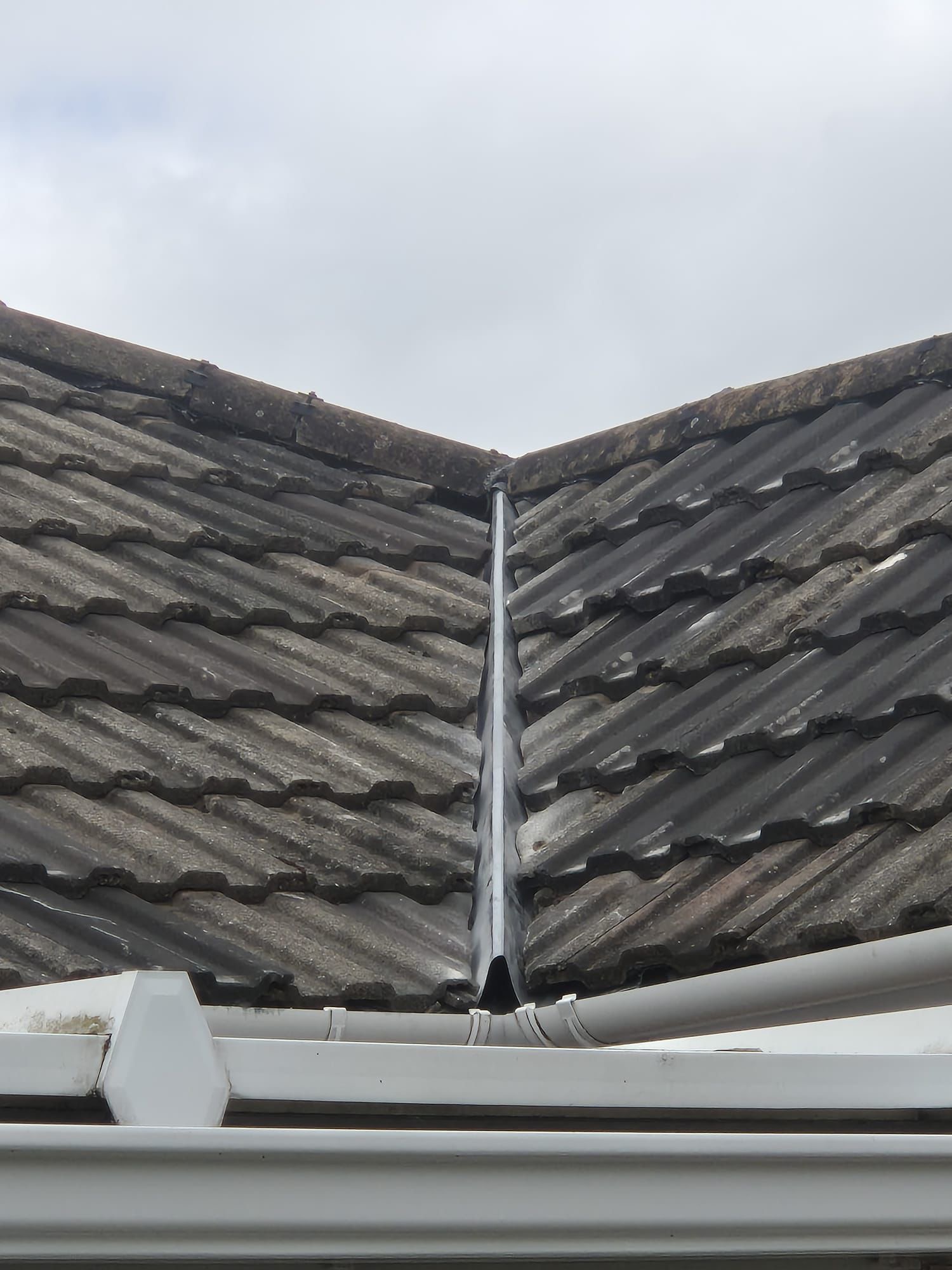 Completed dry valley roofing system in Hampton Magna