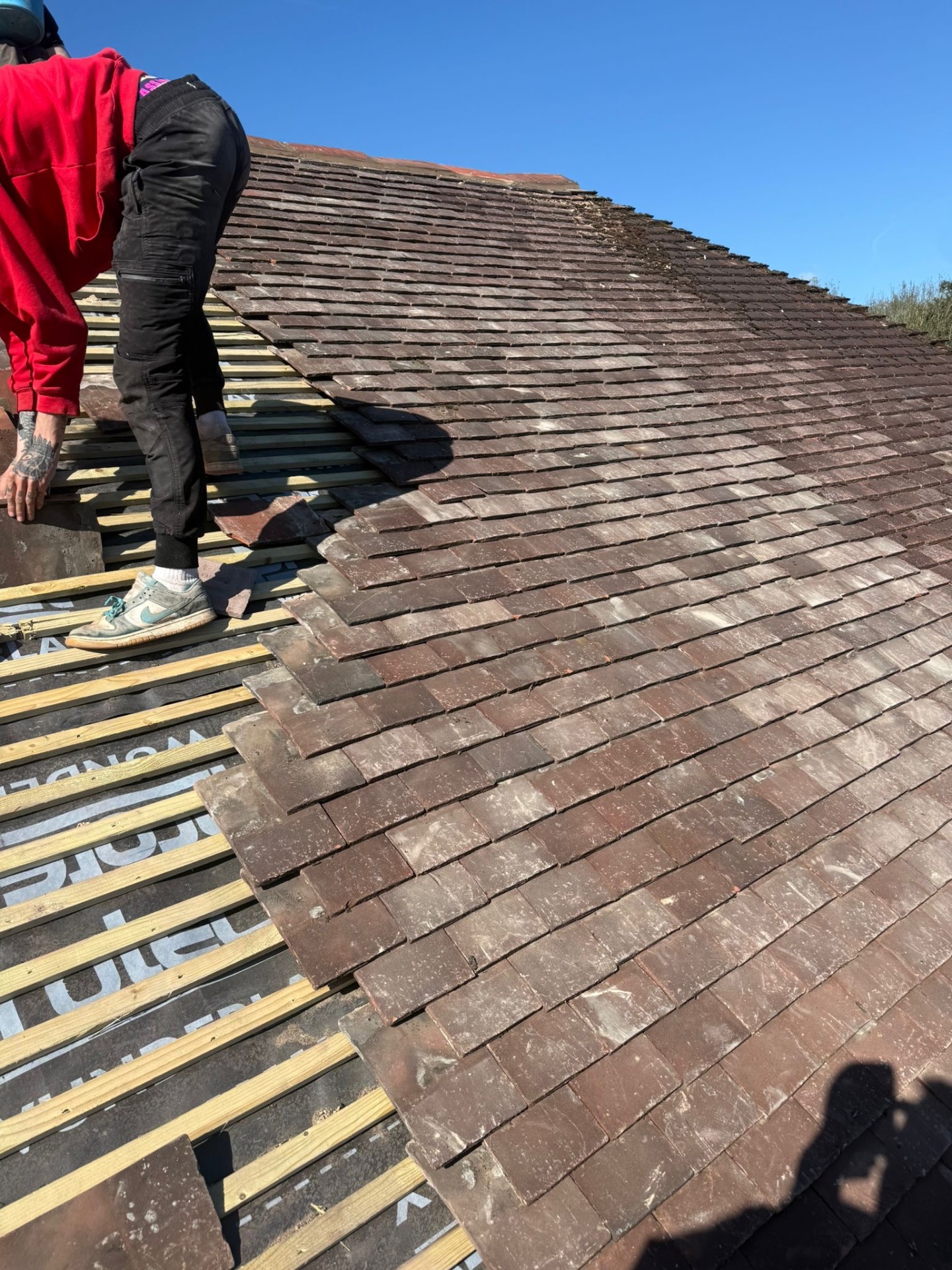 Roof tiles being relaid on the Myton Road job