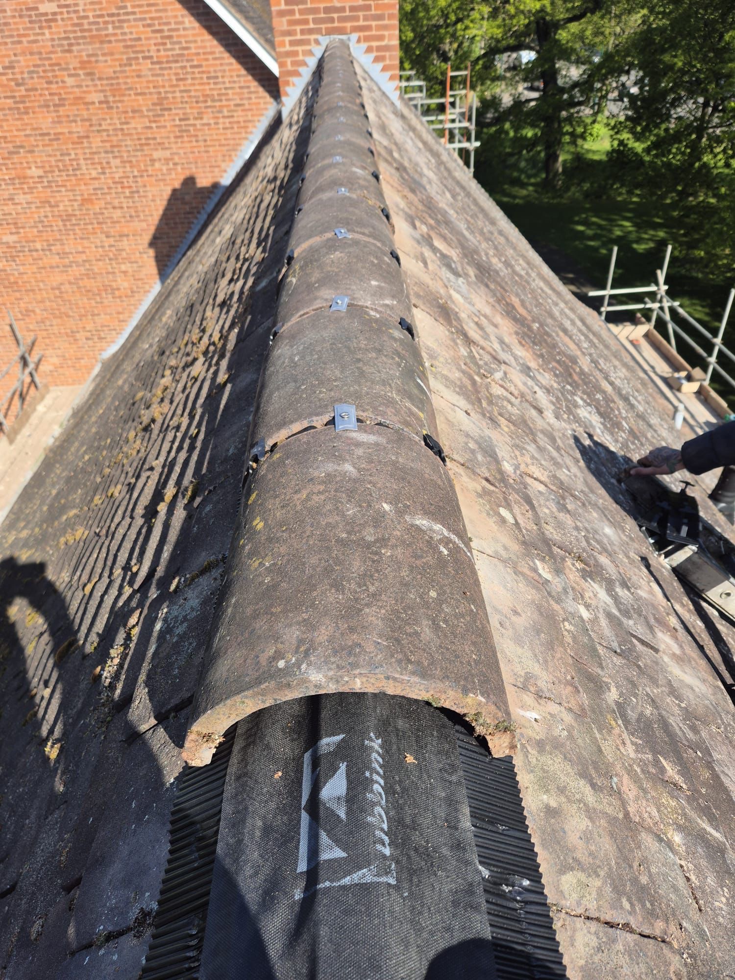 Ridge tiles being re-bedded on the Myton Road job
